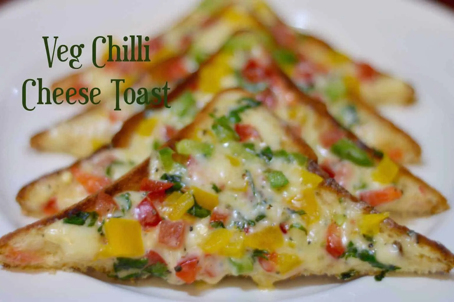 Veg Chilli Cheese Toast layered on a plate