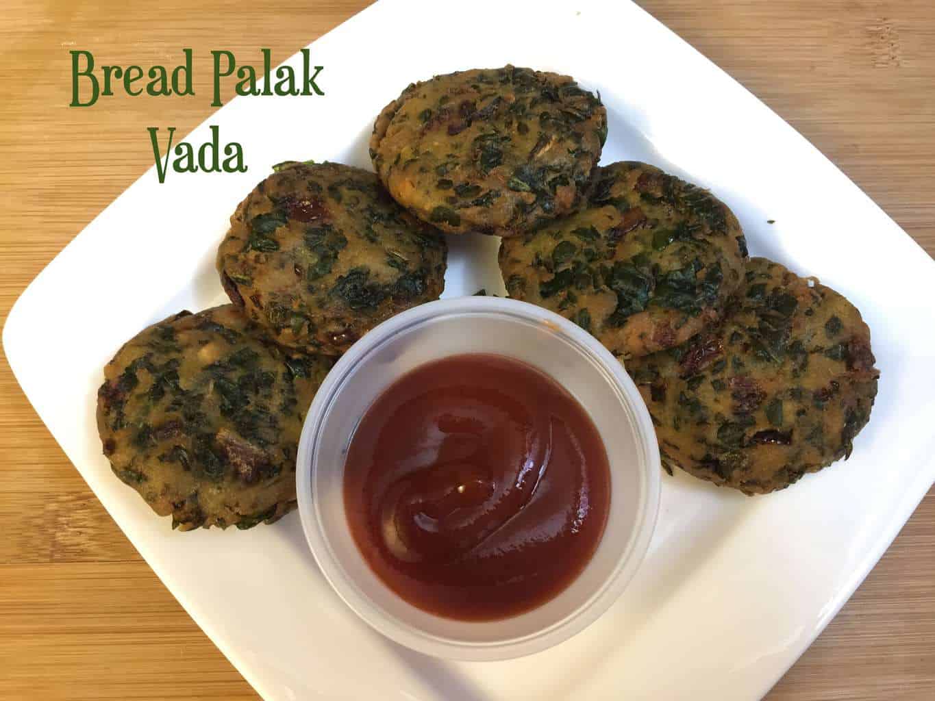 Bread Palak Vada Recipe served on a plate with tomato ketchup on the side