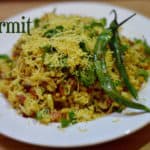 Girmit Recipe served in a plate topped with sev and fried green chili