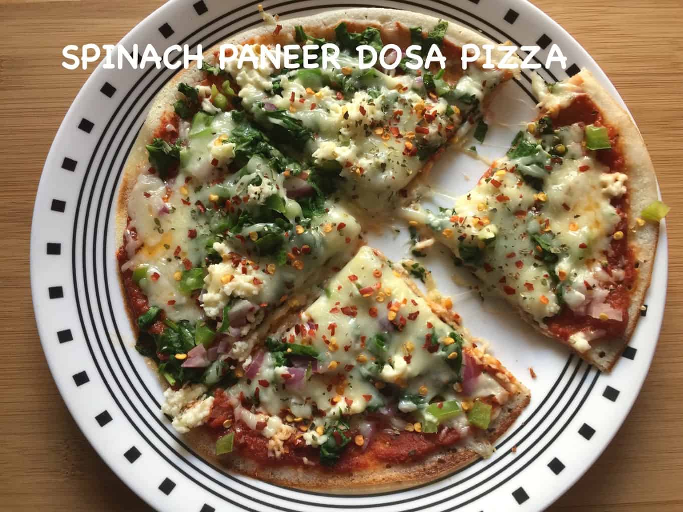 Spinach Paneer Dosa Pizza served on a plate