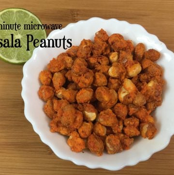 Masala Peanuts served in a bowl with lemon wedge on the side