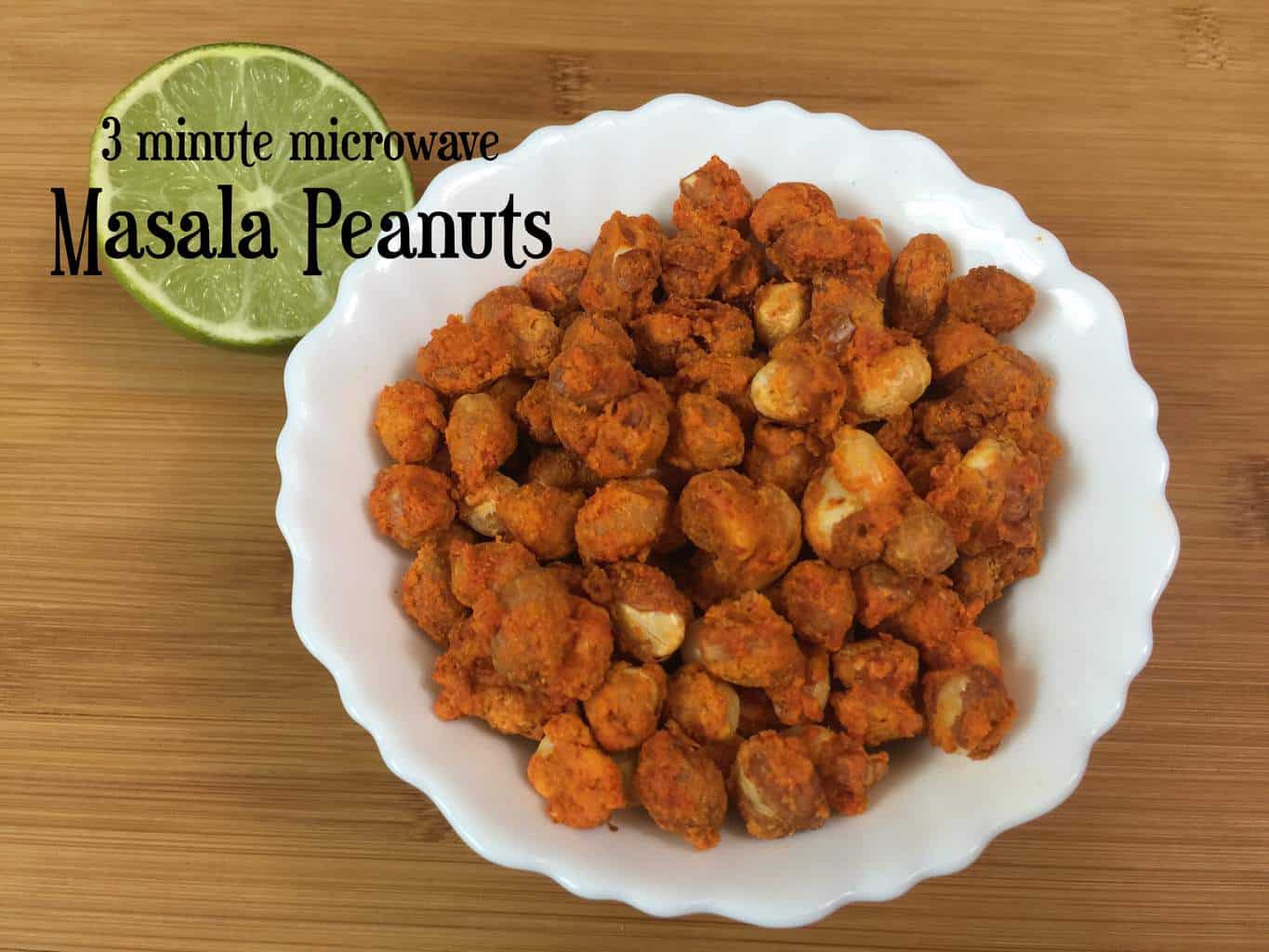 Masala Peanuts served in a bowl with lemon wedge on the side