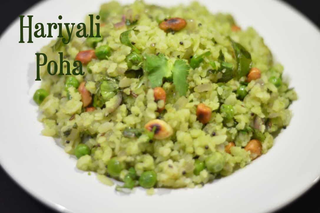 Hariyali Poha | Poha in Green Masala served on a white plate garnished with coriander leaves