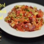 sprouted methi seed salad served on a plate with sprouted methi seeds on the side