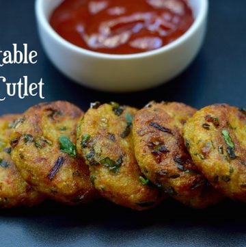 Vegetable Rice Cutlet served on a plate with tomato ketchup on the side