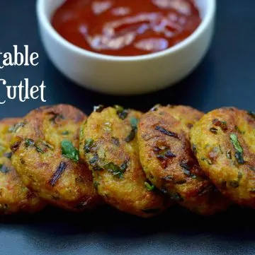 Vegetable Rice Cutlet served on a plate with tomato ketchup on the side