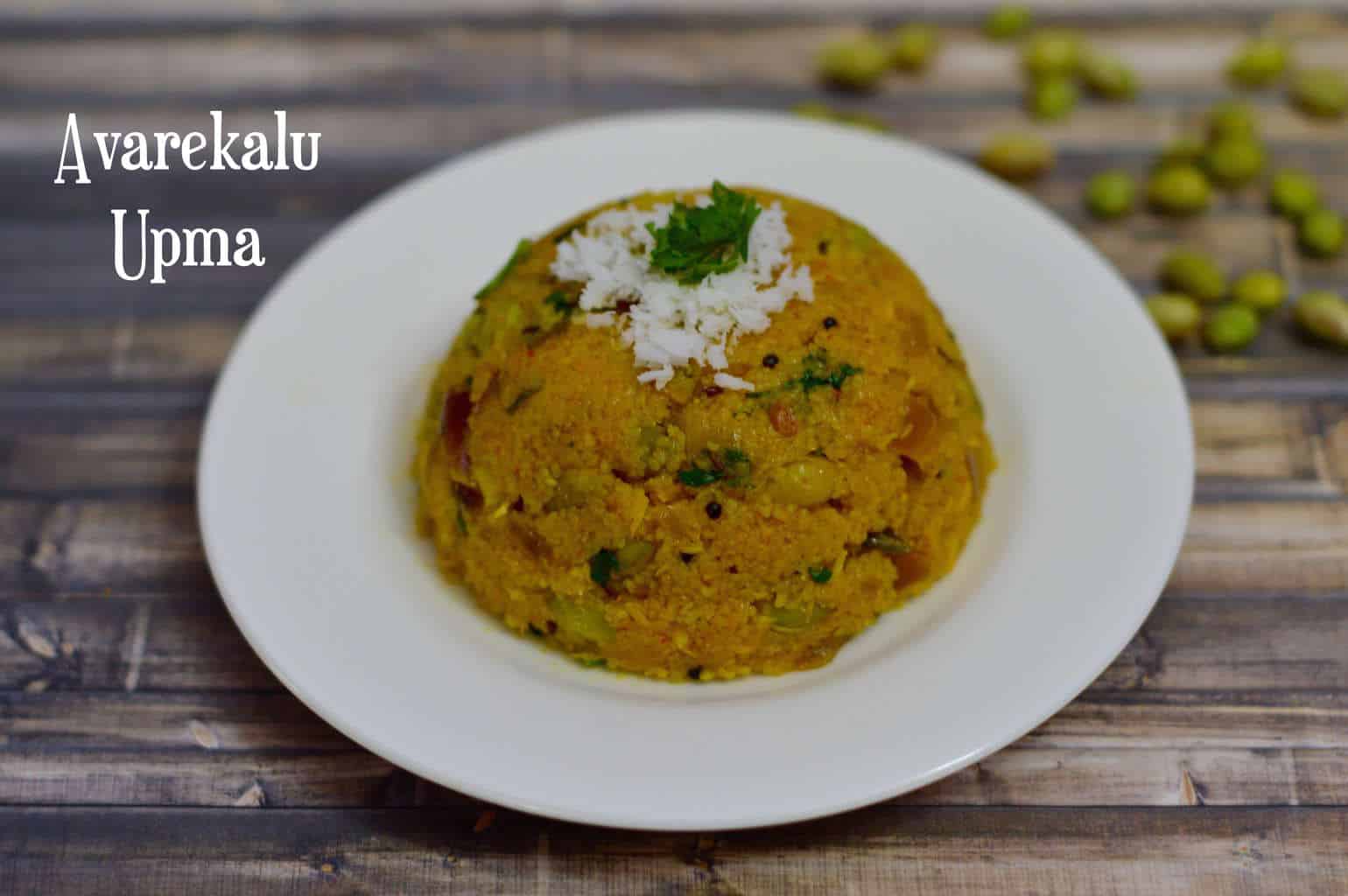Avarekalu Upma served on a plate topped with fresh coconut and cilantro