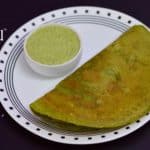 palak moong dal dosa served on a plate with coconut chutney on the side