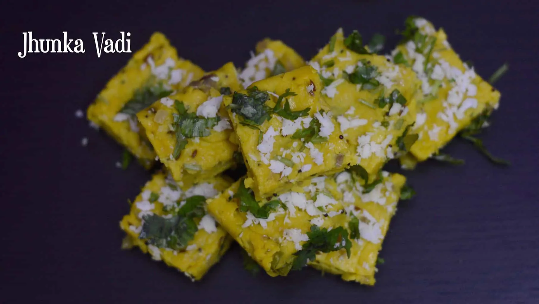 jhunka vadi served on a plate garnished with cilantro and coconut