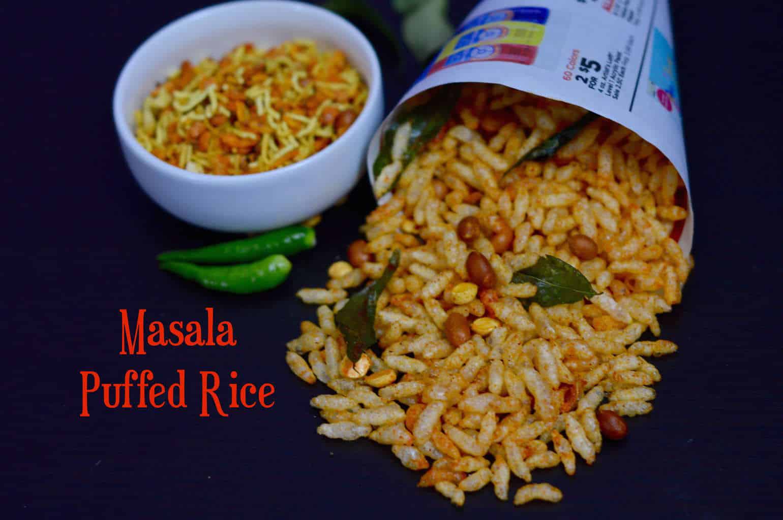 Masala Puffed Rice served in a newspaper cone with sev on the side in a cup