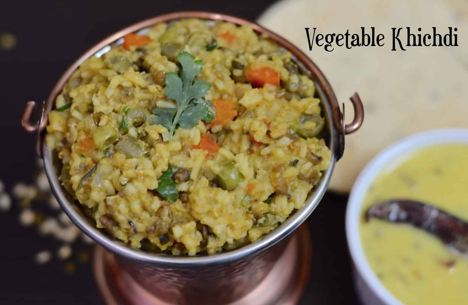 Vegetable Khichdi served in a copper vessel with kadhi on the side