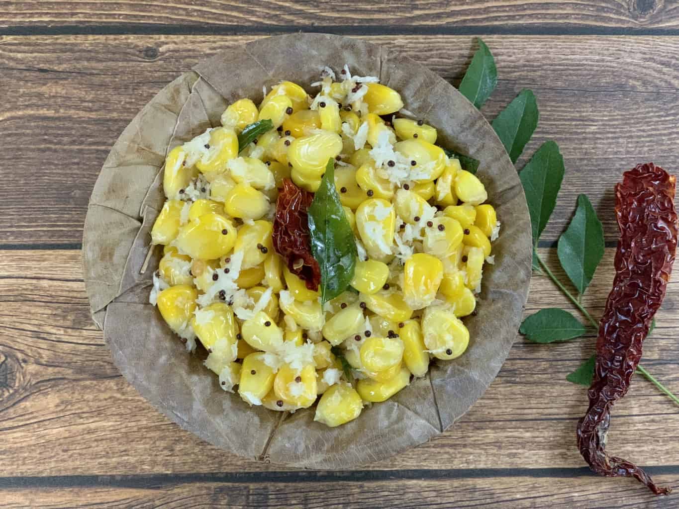 Sweet Corn Sundal served in a bowl with tempering on the top