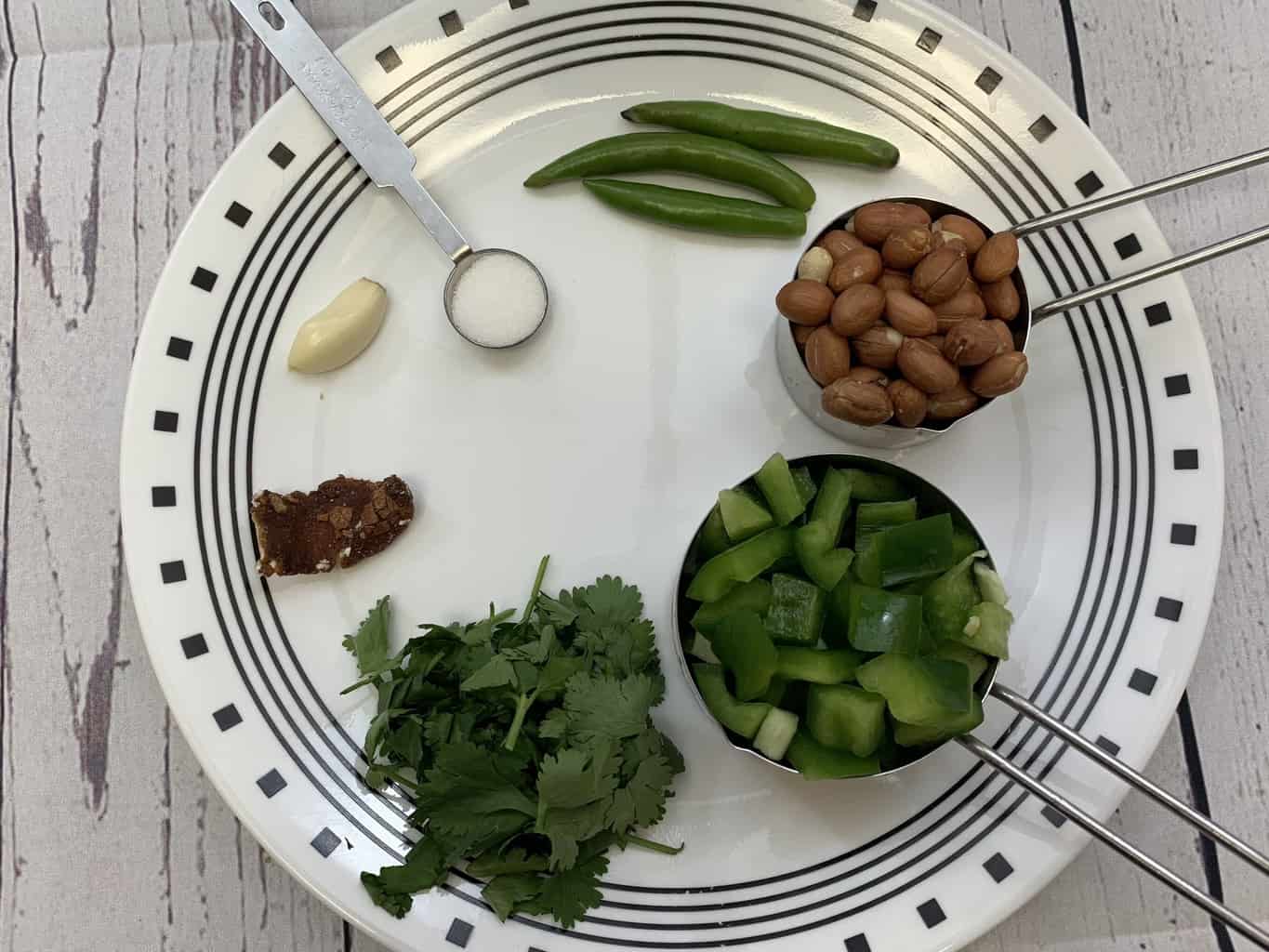 capsicum peanut chutney ingredients on a plate