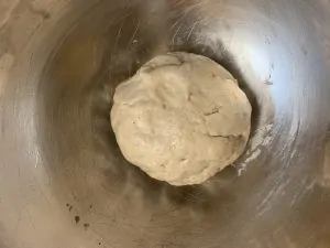 whole wheat flour dough in a steel bowl