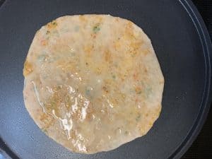 step to cook chole ka paratha on tawa with oil