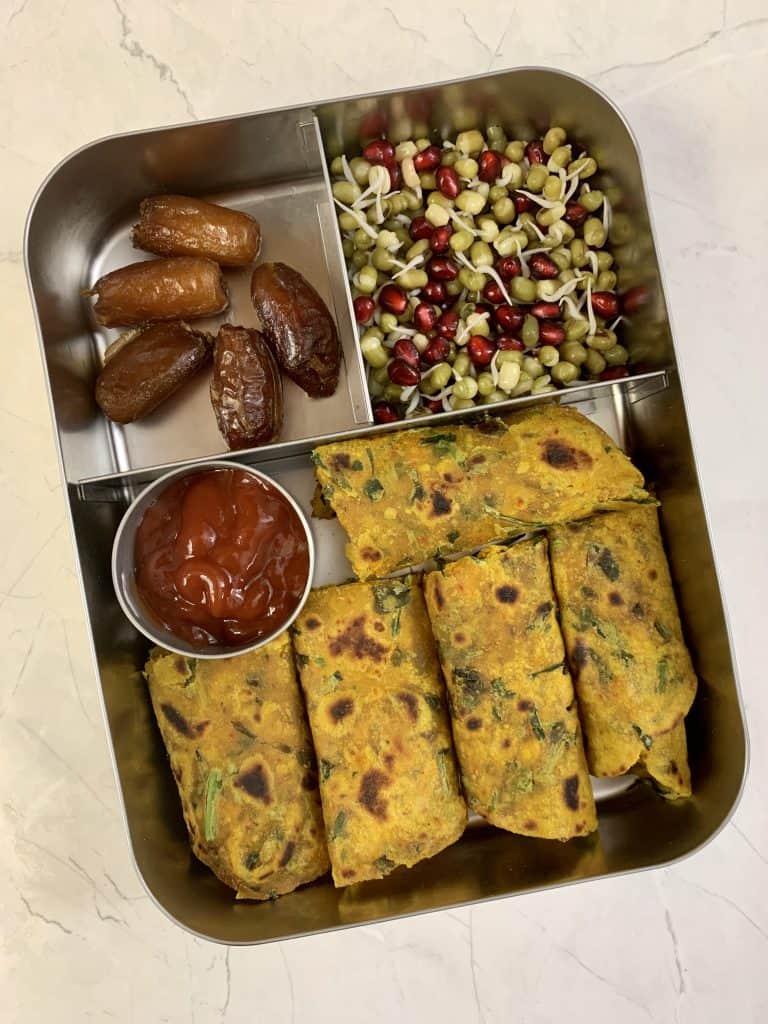 Methi paratha with ketchup, sprouts salad and dates.