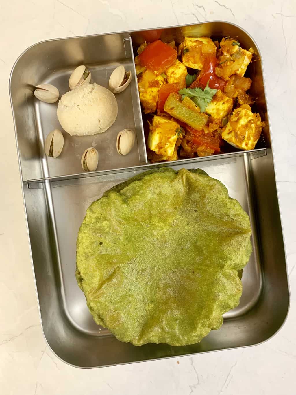 palak puri with paneer jalfrezi and cookies with nuts in bento steel lunch box