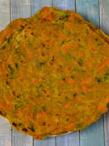 a stack of Zucchini Carrot Paratha served on a plate