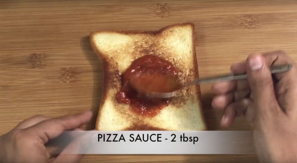 step to apply pizza sauce on the toasted bread