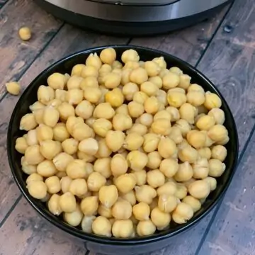 Instant pot boiled chickpeas served in a black bowl