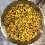 milagai podi rice in a pan garnished with cilantro
