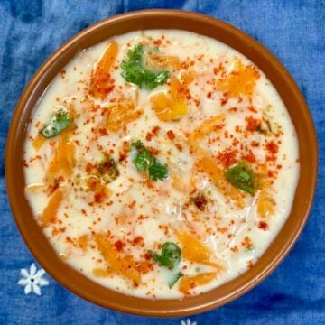 pumpkin raita served in a bowl garnished with cilantro