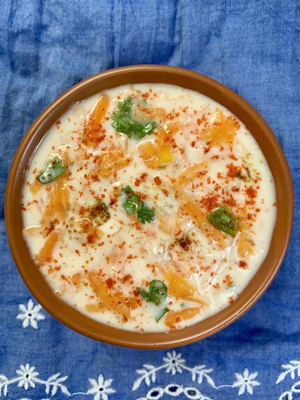 pumpkin raita served in a bowl garnished with cilantro