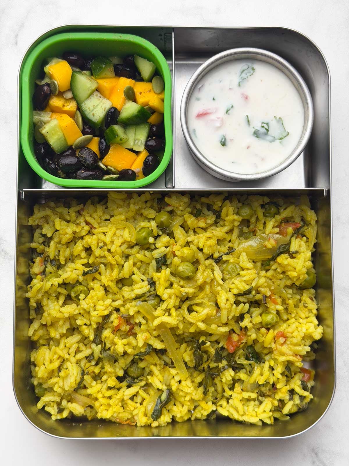 Methi Pulao, Onion Tomato Raita, Mango Cucumber Salad in bento steel box.