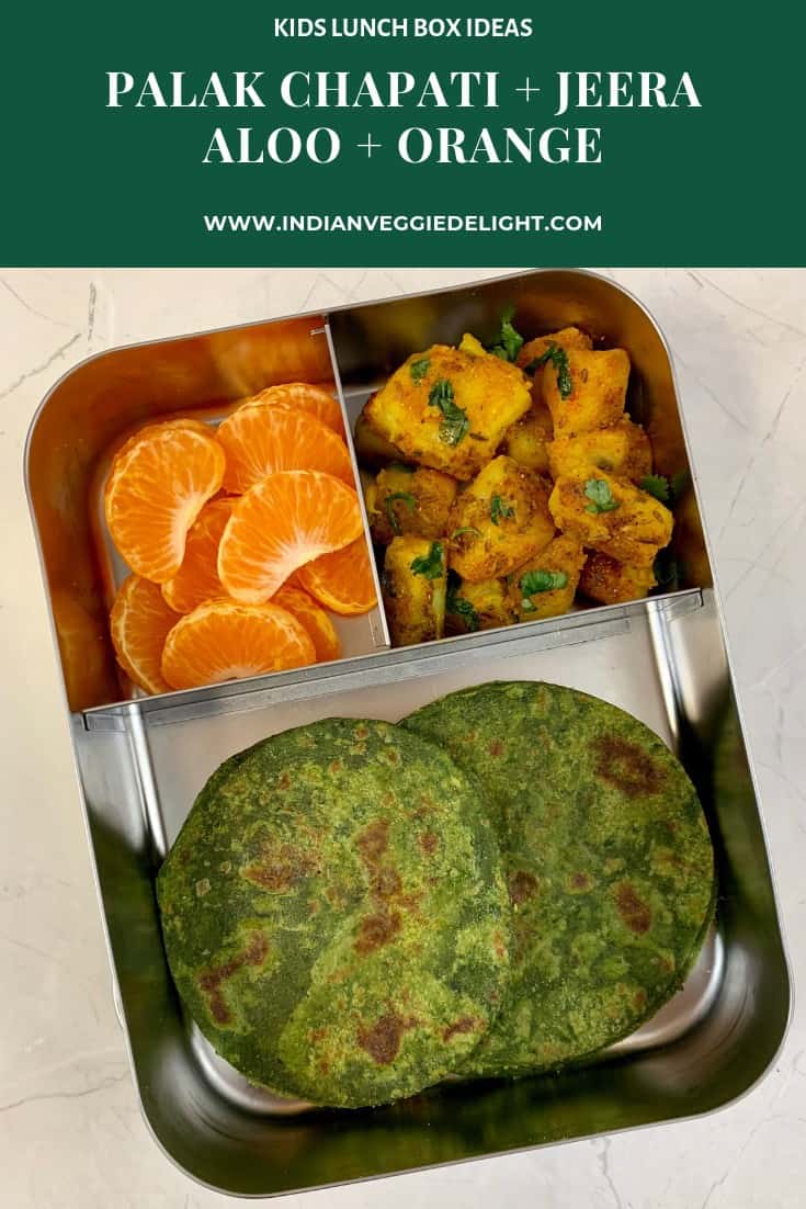 spinach paratha in kids lunch box with orange and aloo jeera