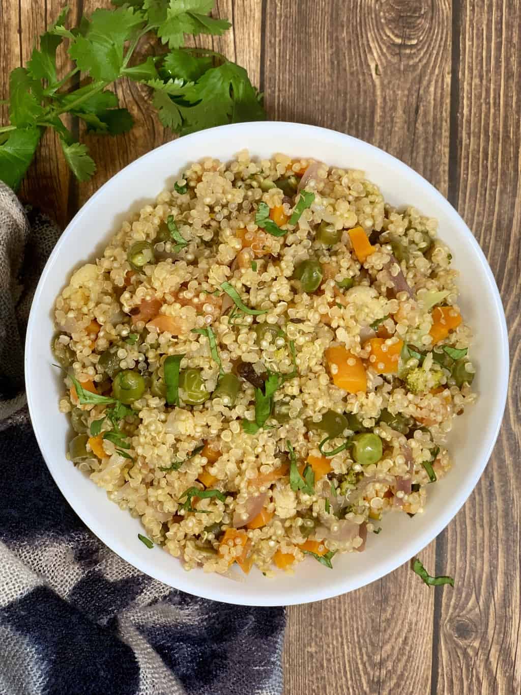 A flavorful healthy one pot meal of pulao made with quinoa and fresh cut vegetables