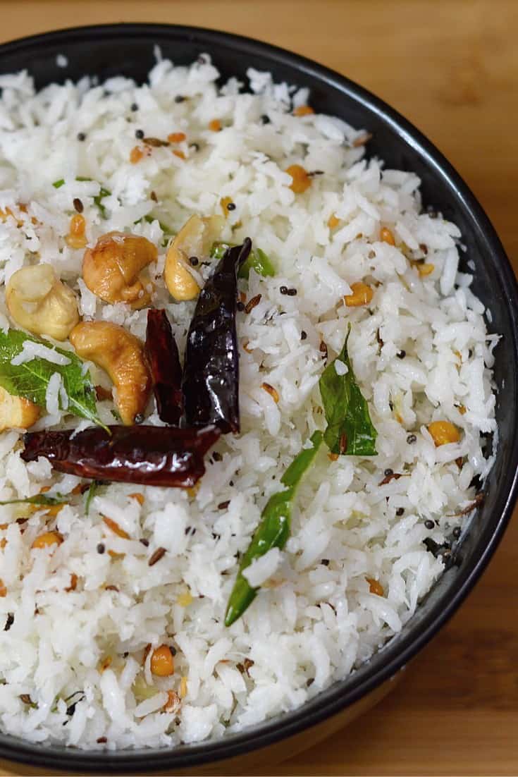 coconut rice served in a bowl with tempering on the top