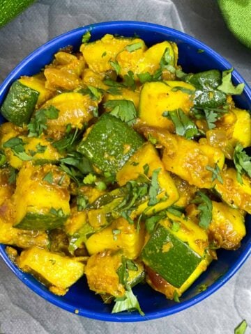 Zucchini Sabji/sabzi served in a bowl garnished with coriander leaves