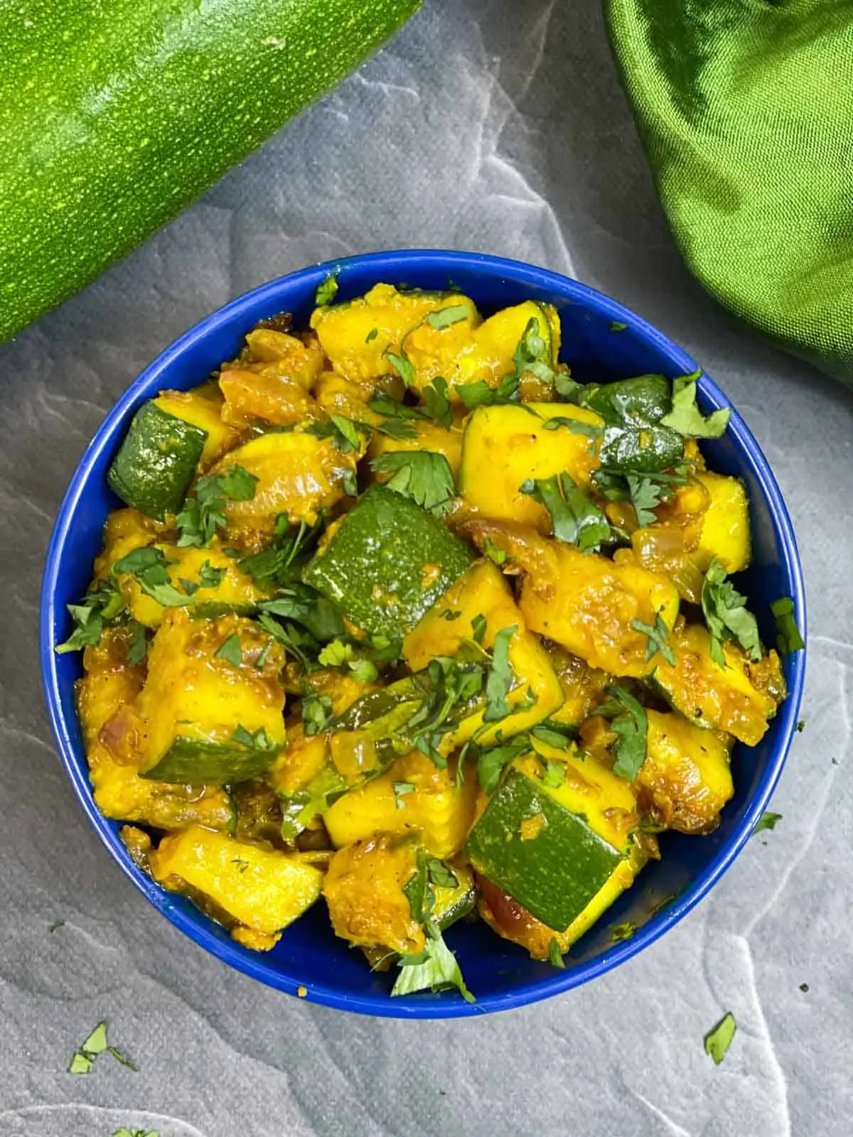 Zucchini Sabji served in a bowl garnished with coriander leaves