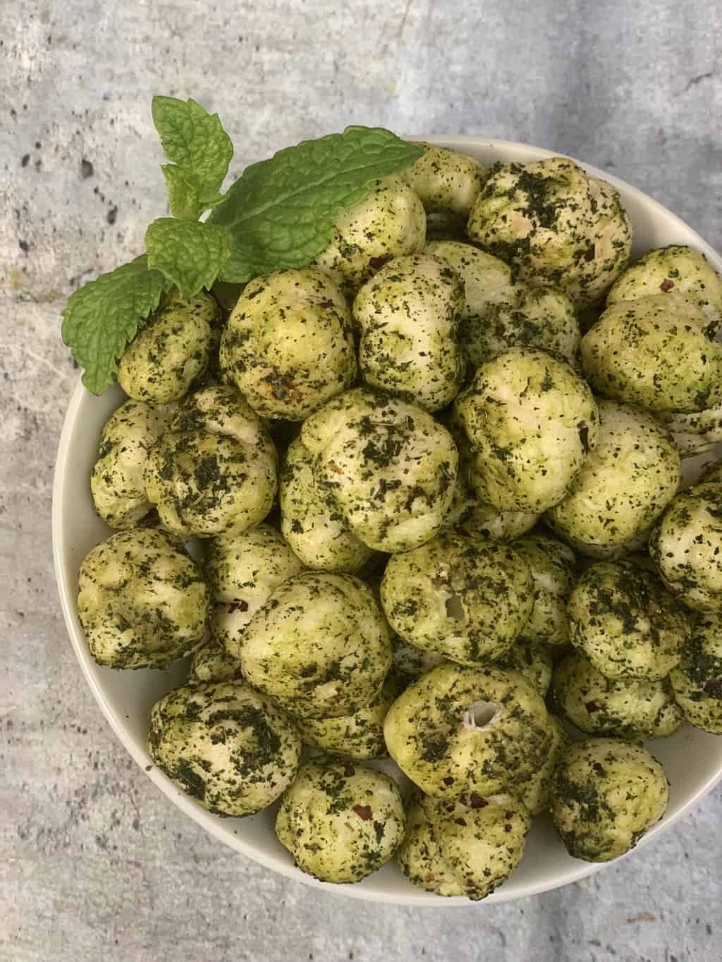 mint makhana served in a bowl with mint leaves on the top