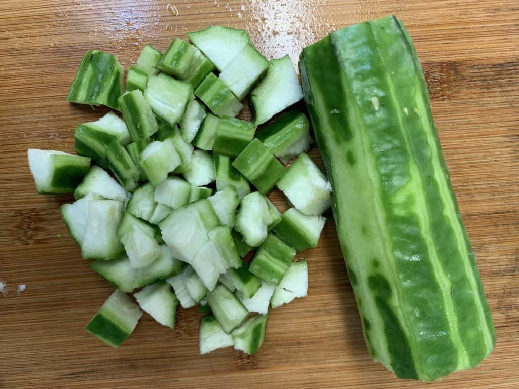 ridge gourd cut in to one inch pieces on a board