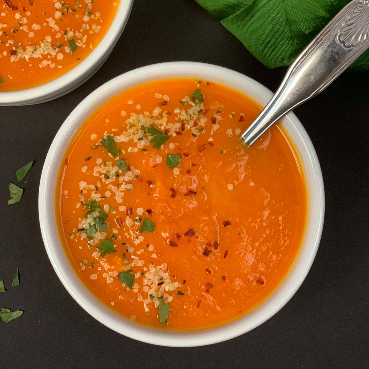 carrot ginger soup served in a white bowl