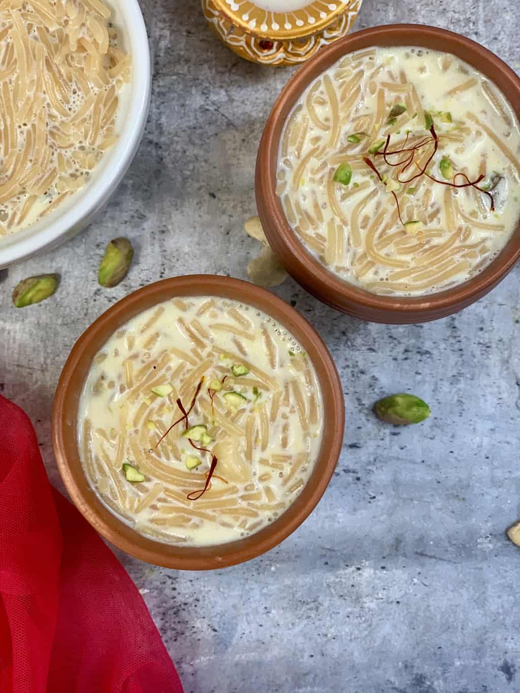 Semiya payasam Instant pot served in two mud pots garnished with nuts and saffron