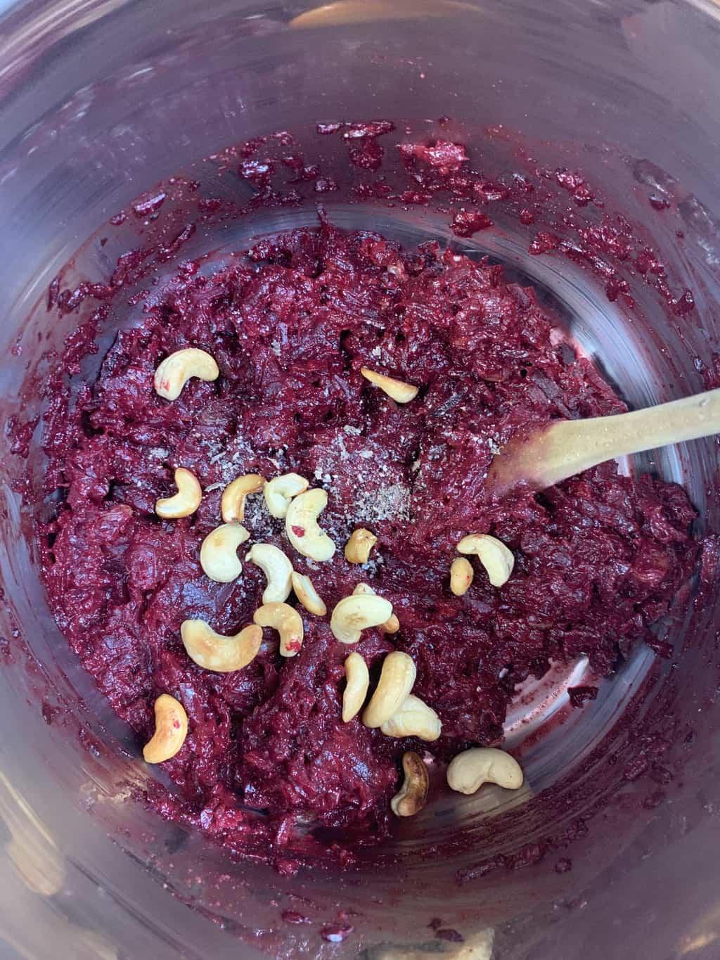 beetroot halwa in instant pot insert garnished with nuts