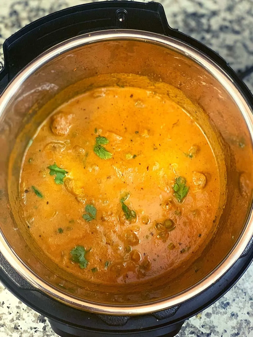 mushroom masala in instant pot insert garnished with cilantro