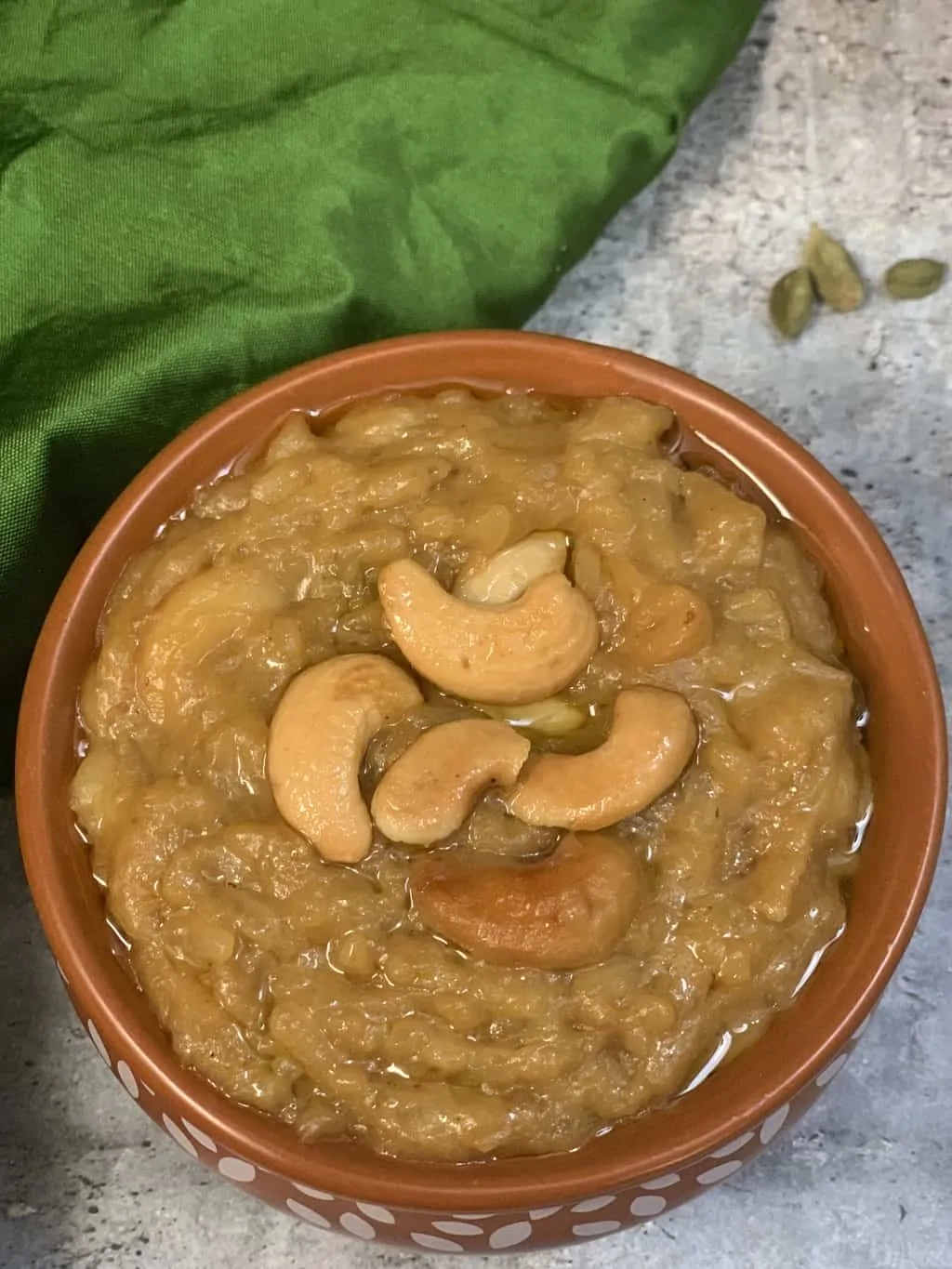 sweet pongal served in a mud pot and roasted cashews nuts on top