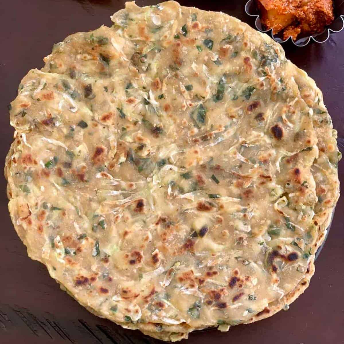 Lauki ka Paratha served in a plate with side of pickle