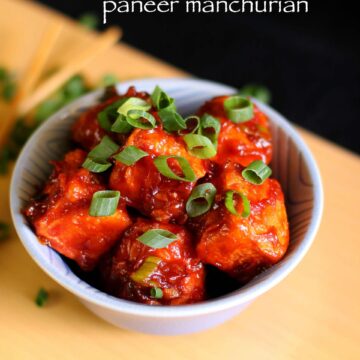 Paneer manchurian in a bowl garnished with spring onions