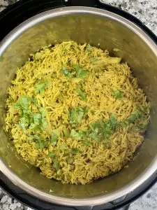 cabbage rice in instant pot insert garnished with coriander leaves