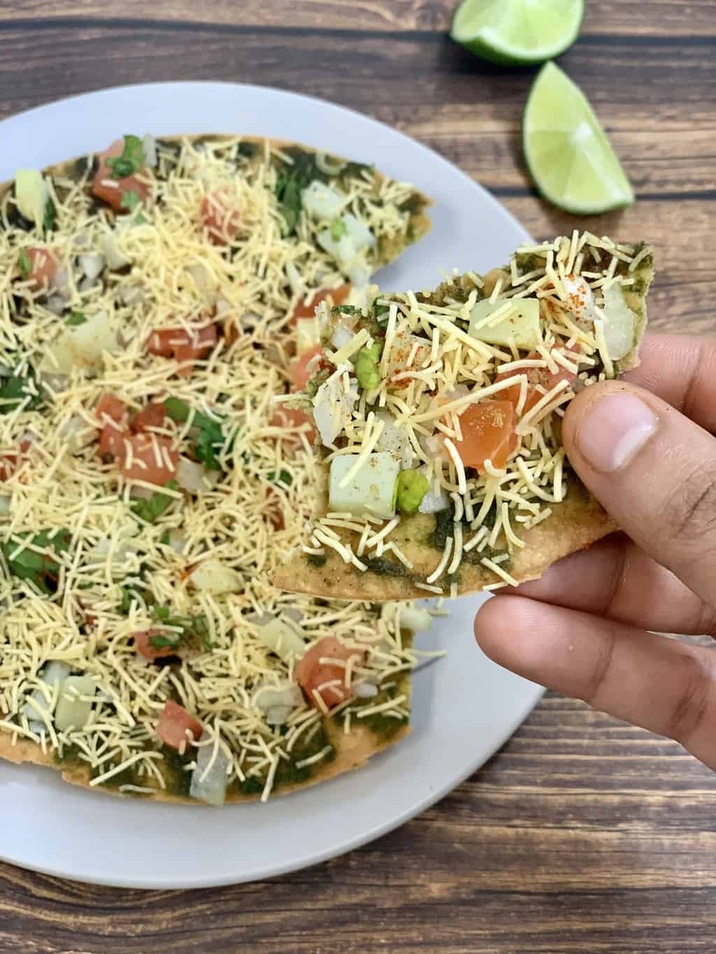 a piece of khakra chaat in a hand