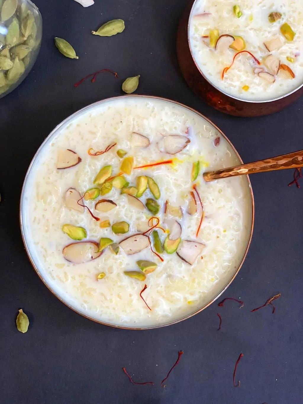 instant pot pudding served in a bowl garnished with pistachios