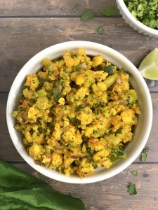 broccoli paneer bhurji served in a bowl with lemon wedge on the side