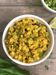 broccoli paneer bhurji served in a bowl with lemon wedge on the side