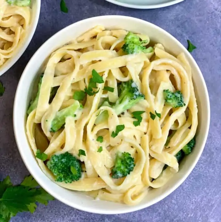 Instant Pot Fettuccini broccoli Alfredo served in a bowl garnished with parsley