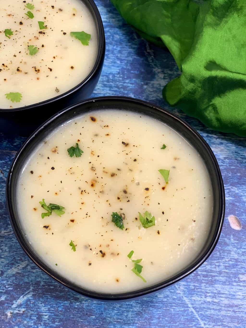 Lauki Soup garnished with pepper and coriander leaves