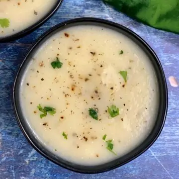 lauki soup served in a bowl garnished with coriander leaves